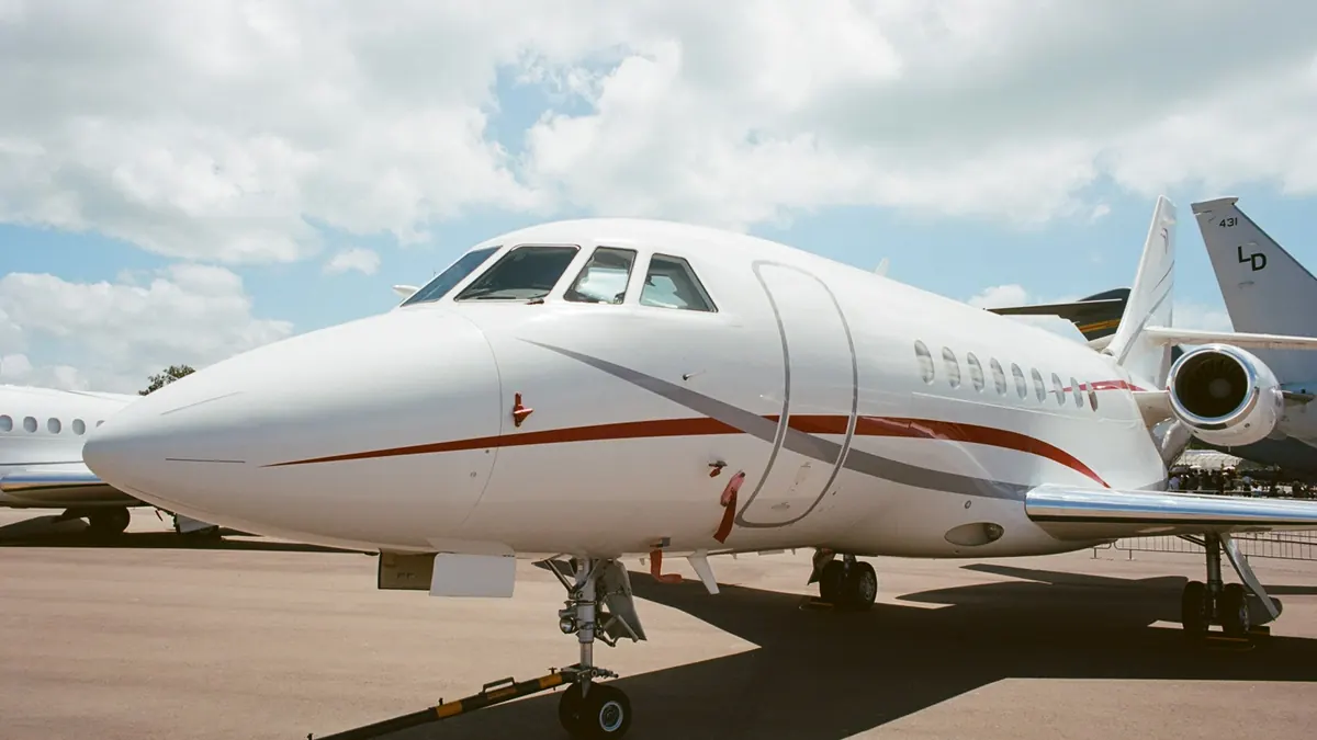Nose of a Falcon business jet on the ramp