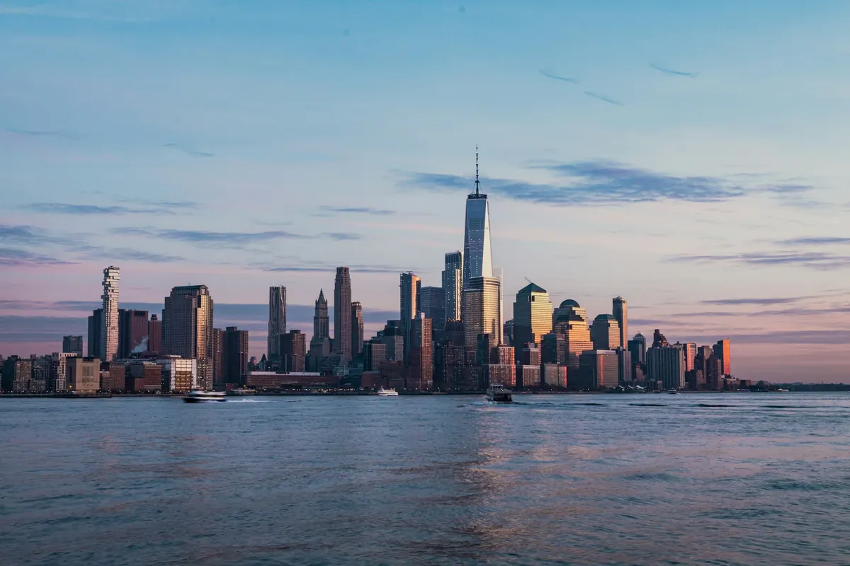 Manhattan skyline across the Hudson River at dusk