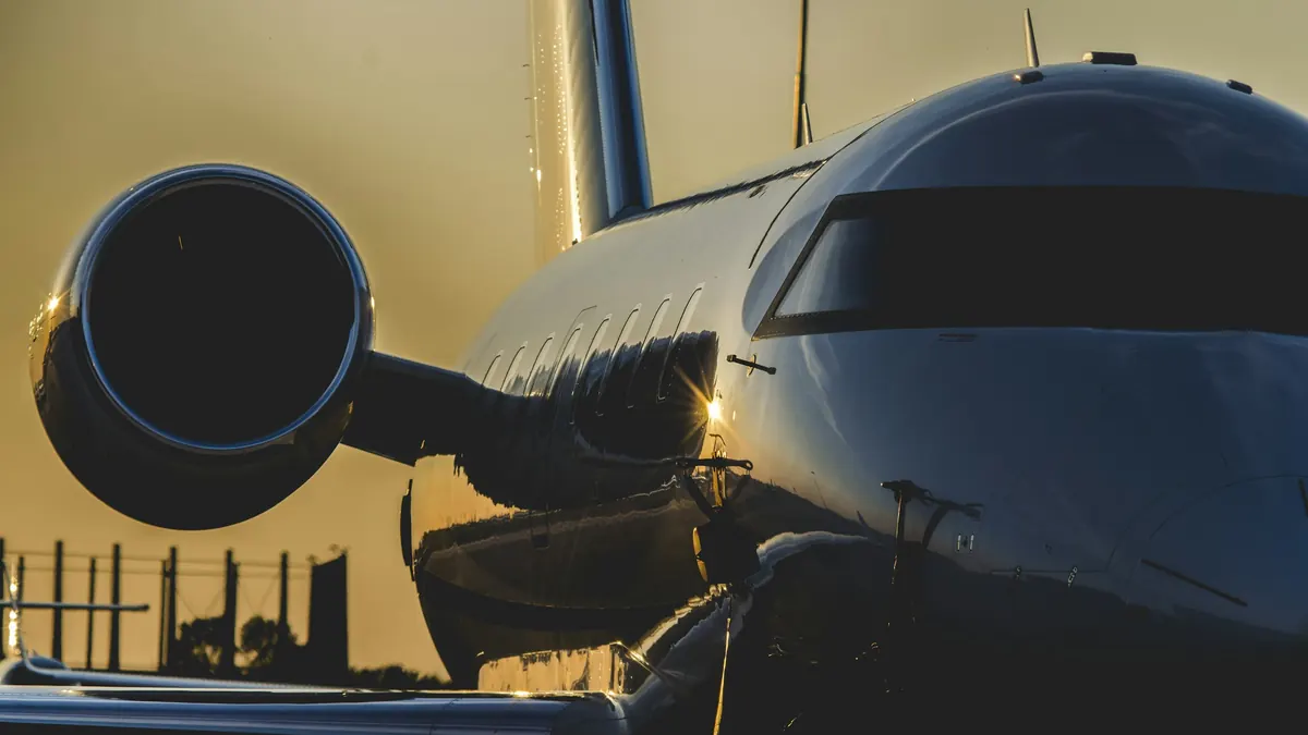 Close view of a business jet engine nacelle in golden evening light